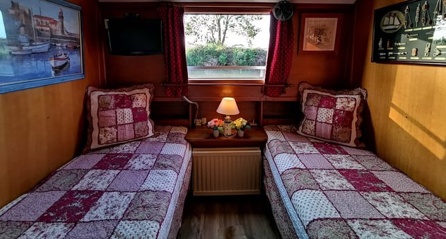 The second bedroom offers two comfortable single beds.