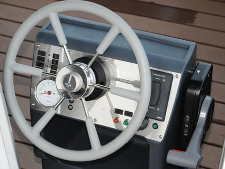 The steering wheel is integrated in the design of this unique houseboat.