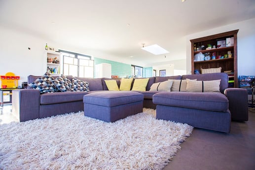 Large couch for the whole family in the living room.