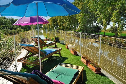 Sun loungers with river view