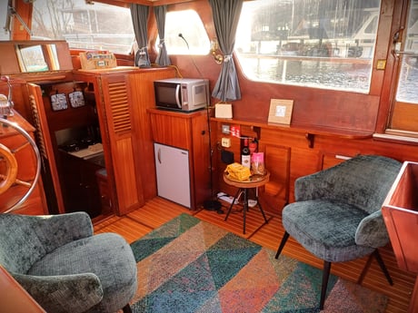 An atmospheric lounge with small armchairs.