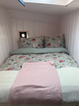 Romantic bed with sneak peak window to the bridge