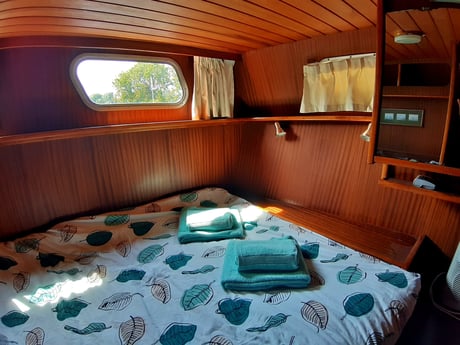 Double master bed in the rear of the boat with closet space.