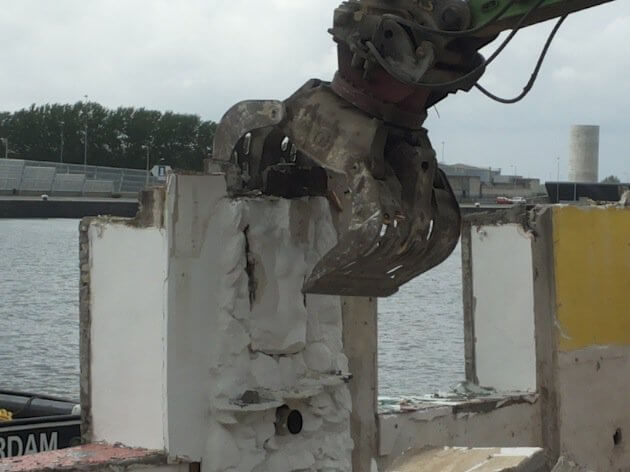 Delicate brutal power - houseboat demolition